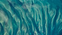 从国际空间站看到的巴哈马周围的蓝绿色水域 (© NASA)
